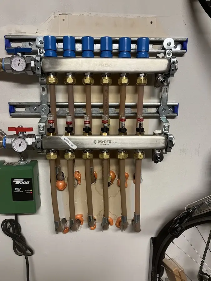 Plumber performing Water Heater Repair at a residential property in Elkhorn